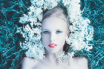 Blonde Woman Portrait with White Flowers and Blue Makeup