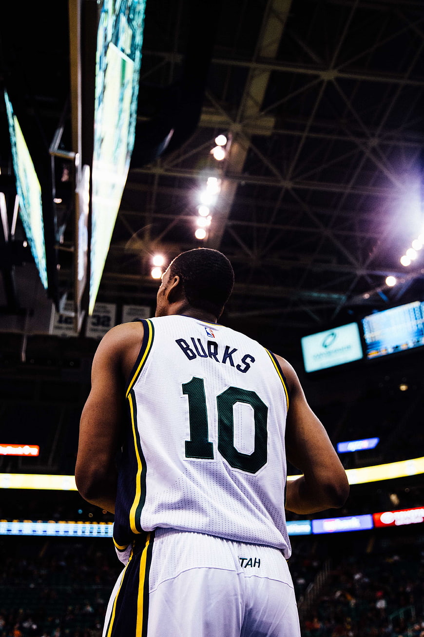 Basketball Player in White Jersey on Court