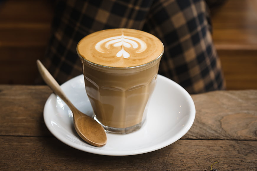 Latte with Heart Art on Wooden Table