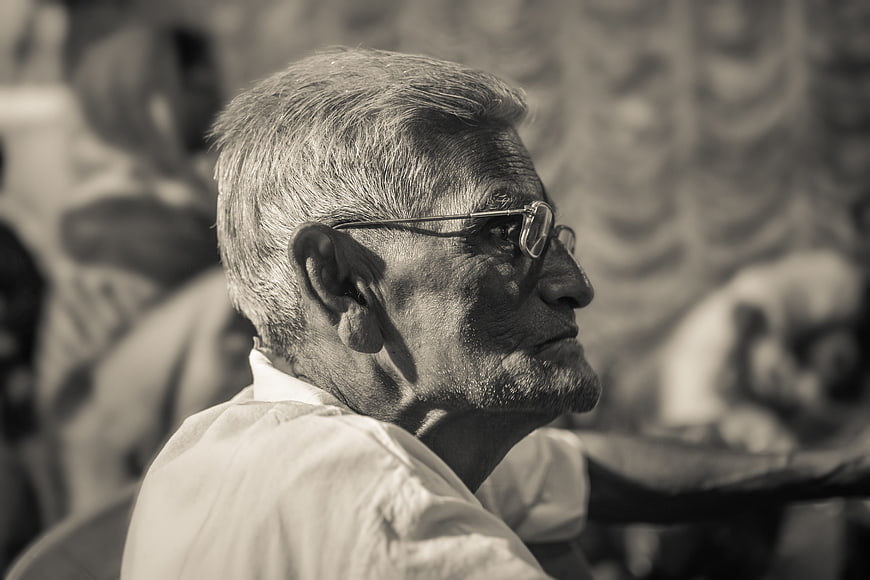 Sepia Portrait of Elderly Man with Glasses in Profile