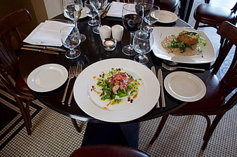 Elegant Restaurant Table Setting With Gourmet Food And Wine