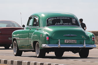 Vintage Green Chevrolet Taxi on Havana Malecon
