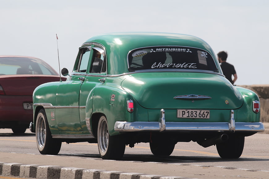Vintage Green Chevrolet Taxi on Havana Malecon