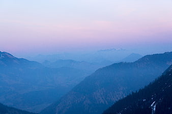 Serene Blue Mountain Landscape with Pink Sky at Dusk