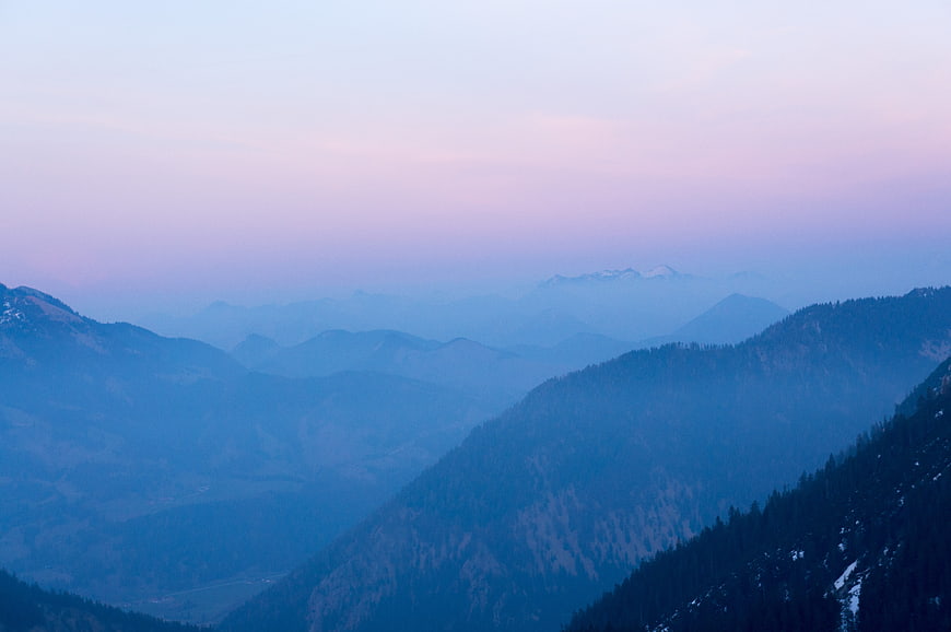 Serene Blue Mountain Landscape with Pink Sky at Dusk