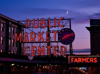 Public Market Center Neon Sign At Dusk With Crescent Moon
