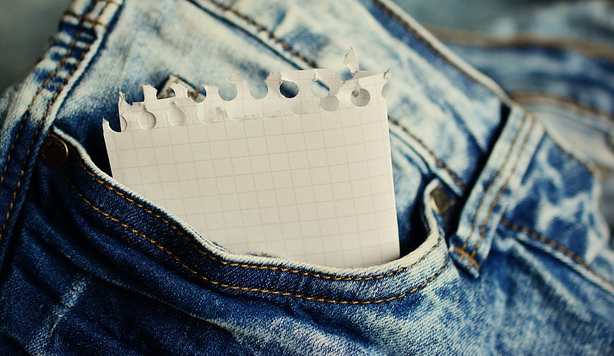 Blank grid notepad in blue denim jeans pocket