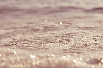 Sparkling Ocean Water Surface with Soft Bokeh Background