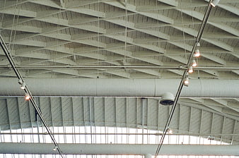 Industrial Ceiling with Geometric Beams and Track Lighting