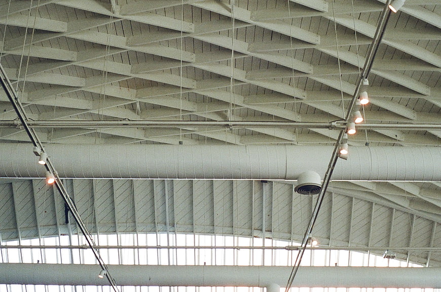 Industrial Ceiling with Geometric Beams and Track Lighting
