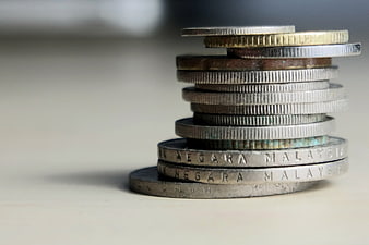 Stack of Malaysian Ringgit Coins on White Surface