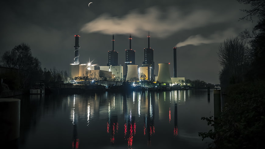 Industrial Power Plant Reflection on Canal at Night