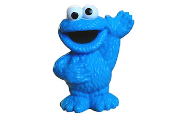 Blue Cookie Monster Muppet Figurine Waving On White Background