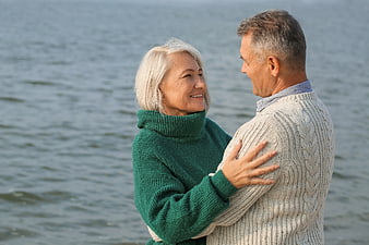 Happy Senior Couple Embracing by the Sea