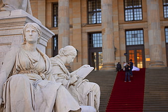 Schiller Monument statues and Konzerthaus Berlin architecture