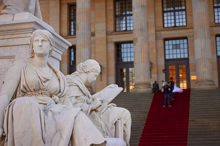 Schiller Monument statues and Konzerthaus Berlin architecture