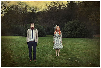 Vintage couple portrait in a moody autumn park setting