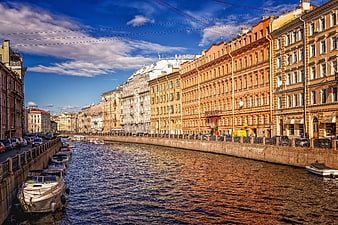 Historic Canal in St. Petersburg with Classic Architecture and Boats