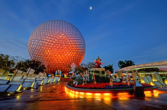 Spaceship Earth at Epcot with Halloween decorations at dusk