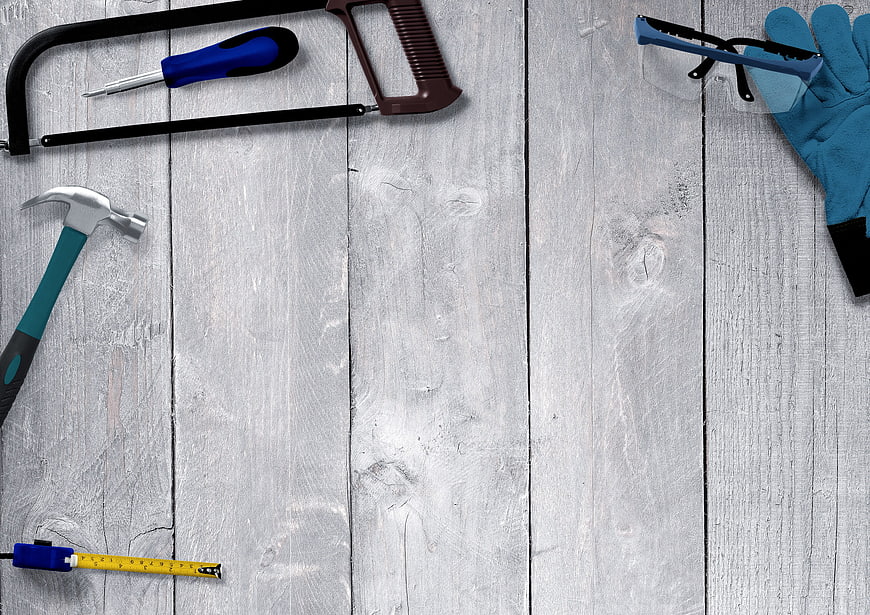 Handyman tools on white wooden background with copy space