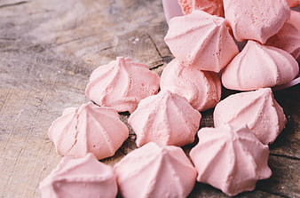 Pink Meringue Cookies Spilled on Rustic Wooden Table