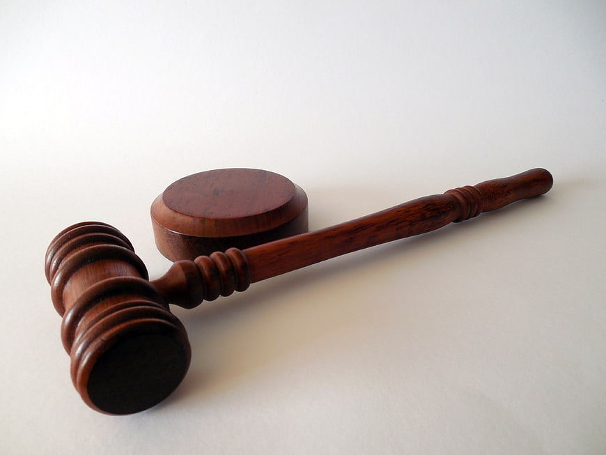 Wooden Judge Gavel and Sound Block on White Background