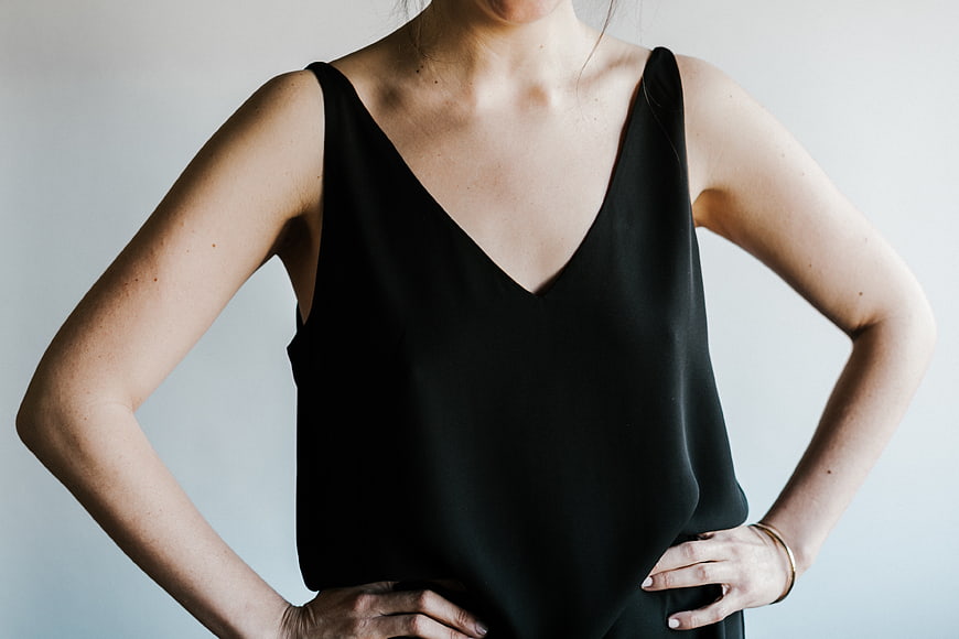 Woman in Black Sleeveless Top with Hands on Hips