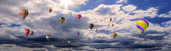 Colorful Hot Air Balloons Floating In Dramatic Cloudy Sky