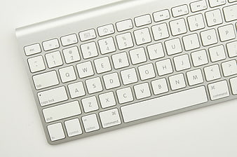 Close-up of Silver Wireless Keyboard on White Background