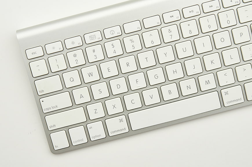 Close-up of Silver Wireless Keyboard on White Background