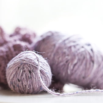 Soft purple yarn balls for knitting and crochet