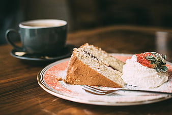 Slice of Strawberry Cake with Coffee on Wooden Table