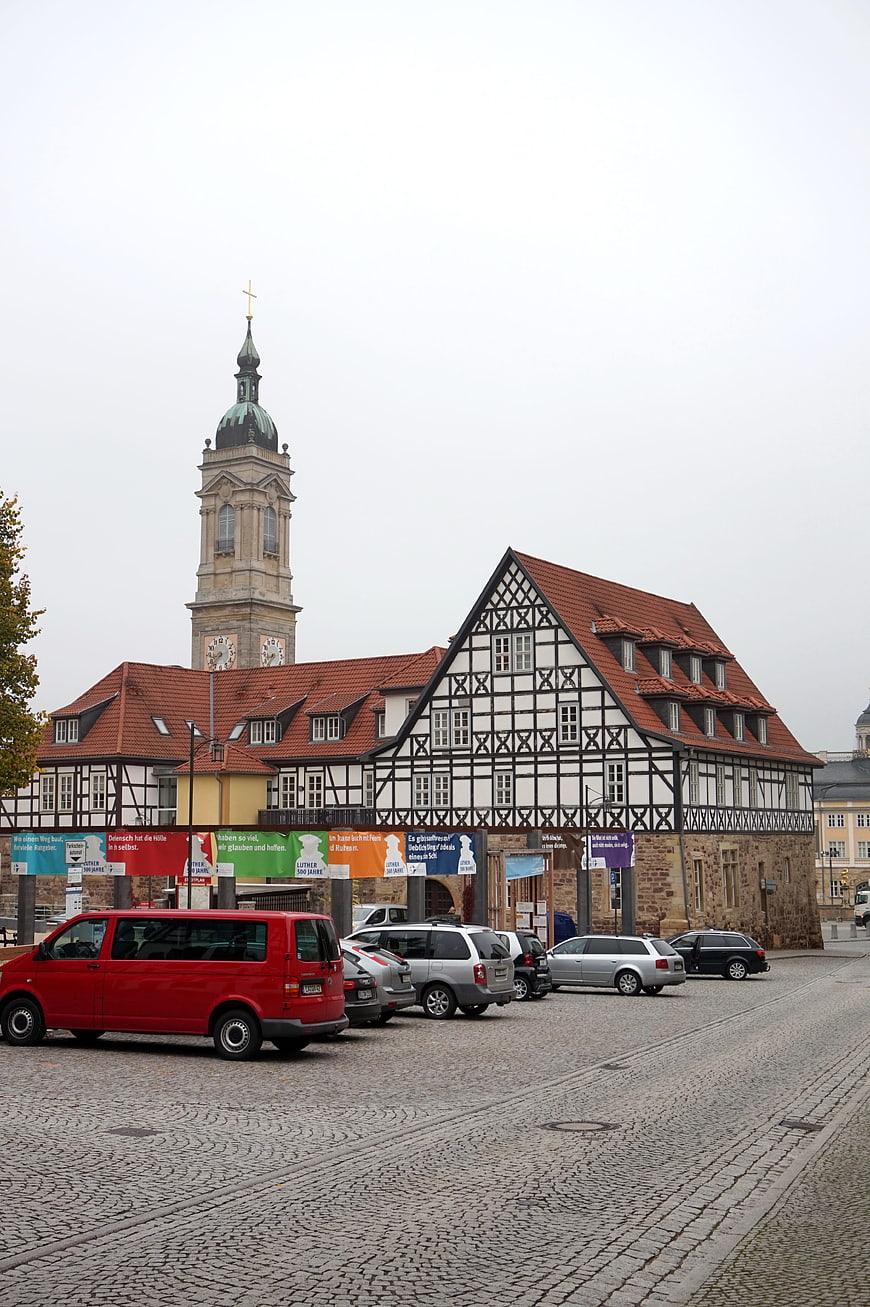 Historic half-timbered building and church tower in Eisenach, Germany