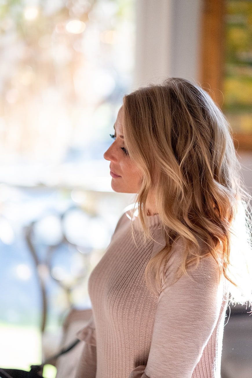Profile Portrait of Blonde Woman in Beige Sweater