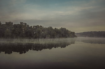 Misty Lake Landscape with Forest Reflection at Dawn