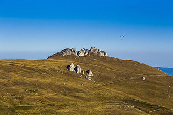 Paraglider Soaring Over Rarau Mountain in Bucovina, Romania