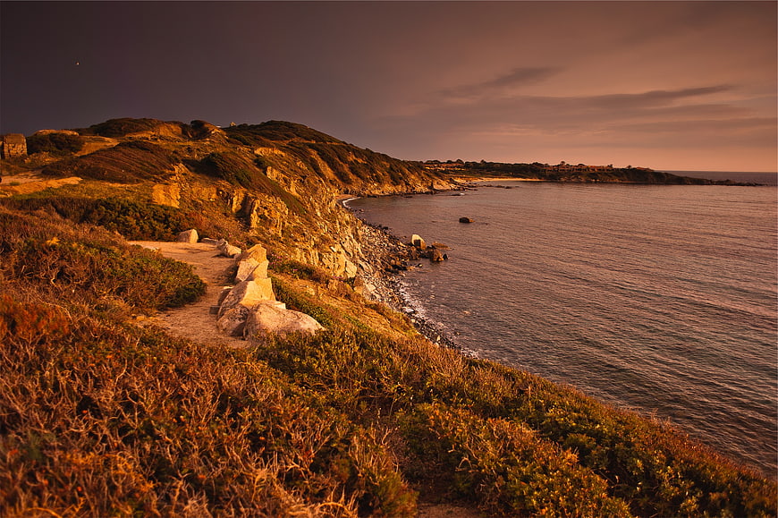 Golden Hour Coastal Cliff Path Overlooking Ocean at Dusk