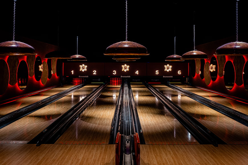 Empty Retro Bowling Alley Lanes with Vintage Lighting