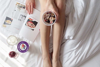 Woman Eating Healthy Breakfast in Bed