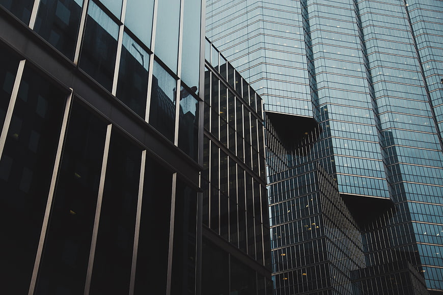 Modern Glass Skyscraper Architecture with Geometric Reflections