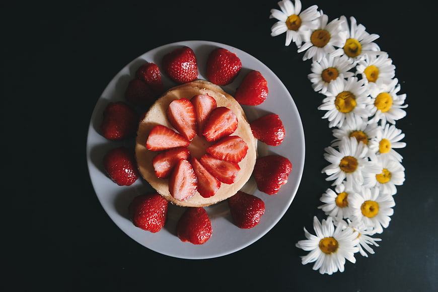 Strawberry Pancake with Daisies on Dark Background