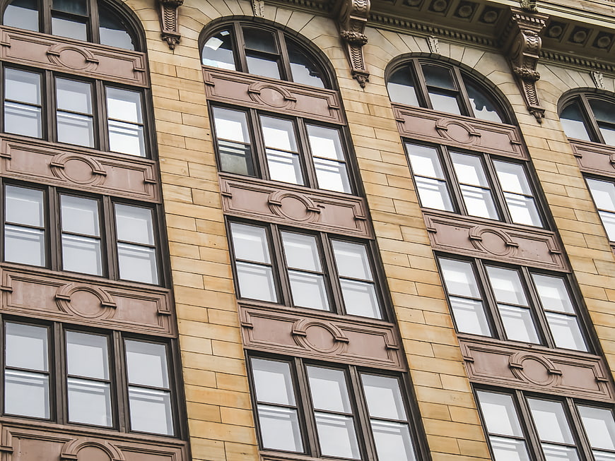 Ornate Arched Windows on Historic Building Facade