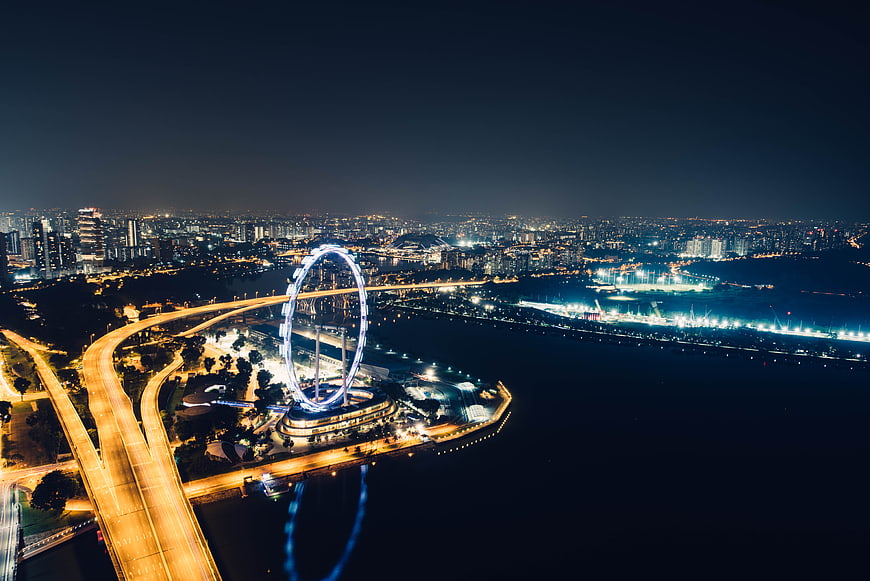 Aerial Night View of Dubai Eye Ferris Wheel and City Skyline