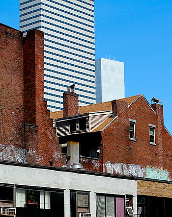 Urban Architecture Contrast: Brick Building and Skyscraper