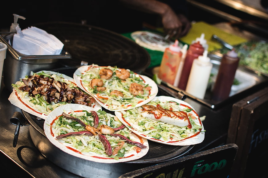 Fresh street food wraps with shrimp and meat toppings