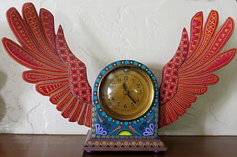 Colorful Winged Clock with Mexican Folk Art Design