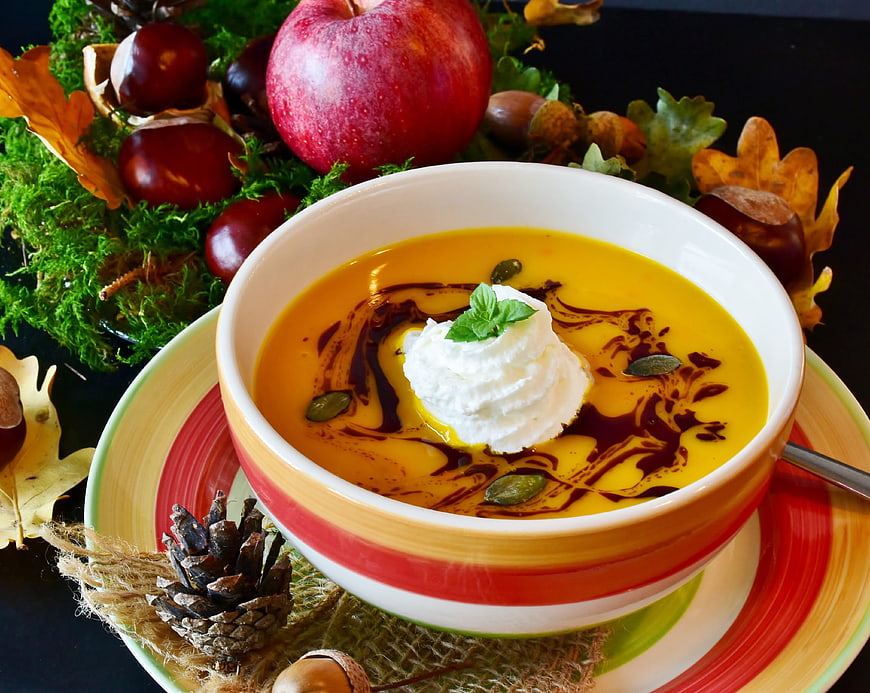 Autumn Pumpkin Soup with Cream, Seeds, and Balsamic Drizzle