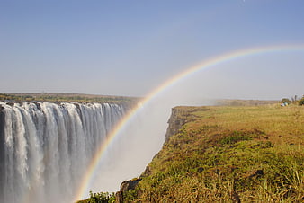 Victoria Falls Waterfall With Rainbow Over Zambezi River