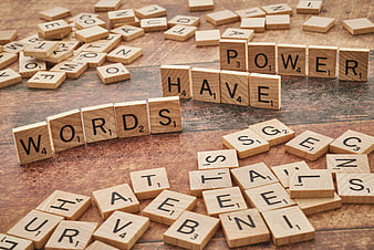 Wooden Scrabble Tiles Spelling Words Have Power on Table