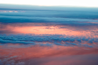 Aerial View of Pink and Blue Clouds at Sunset